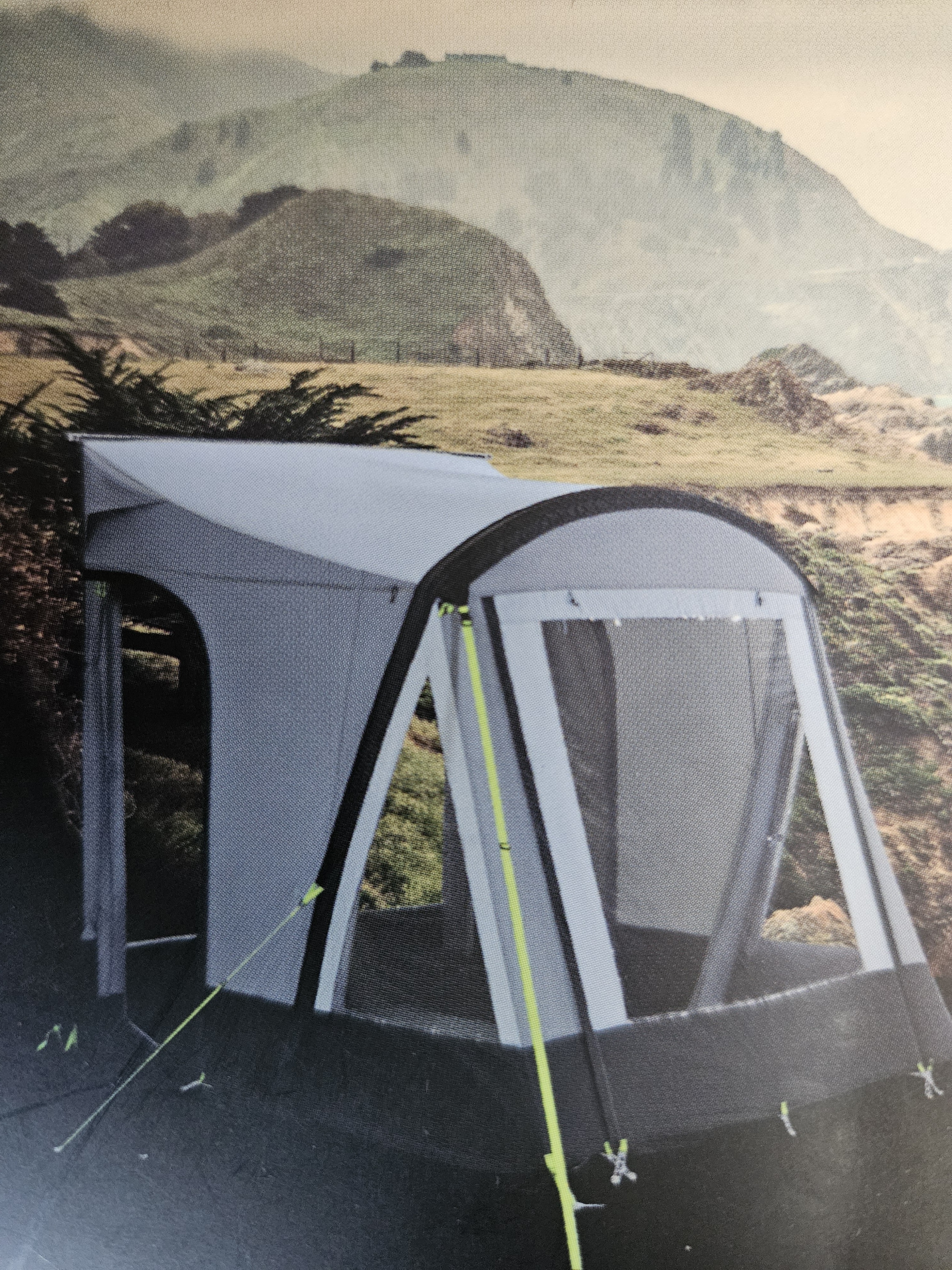Outside awning tent extending living space beside a motorhome