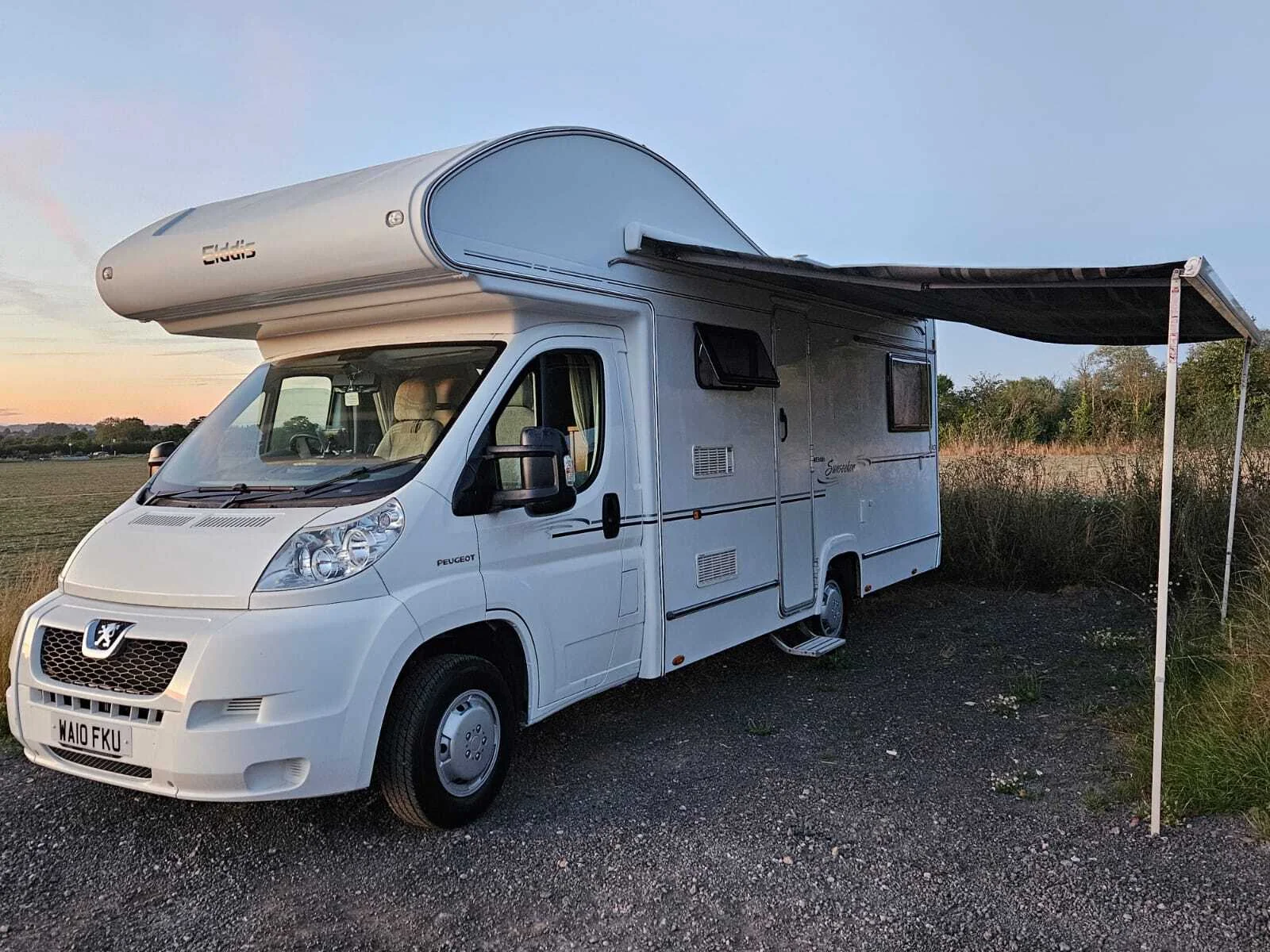 Beatrice with awning out at dusk