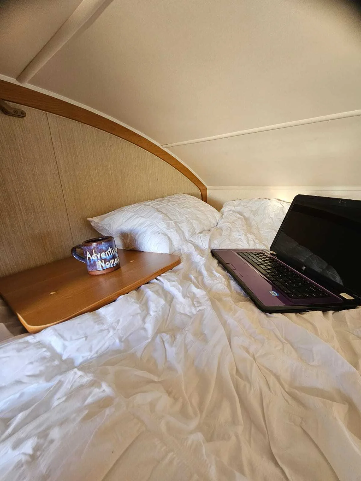 Beatrice over-cab bed lifestyle with mug